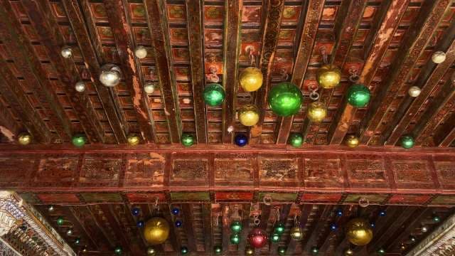 Ornate Wooden Ceiling With Colorful Hanging Glass Ornaments