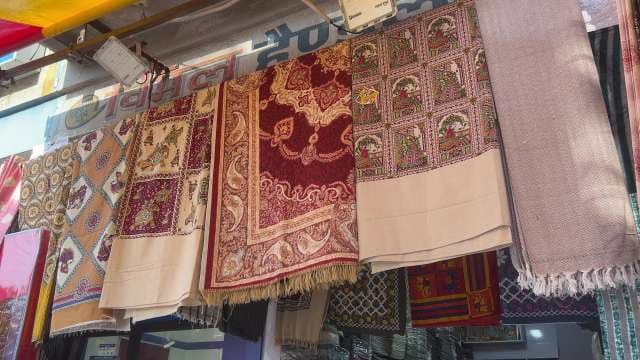 Vibrant Indian Textiles Displayed at Local Market Stall