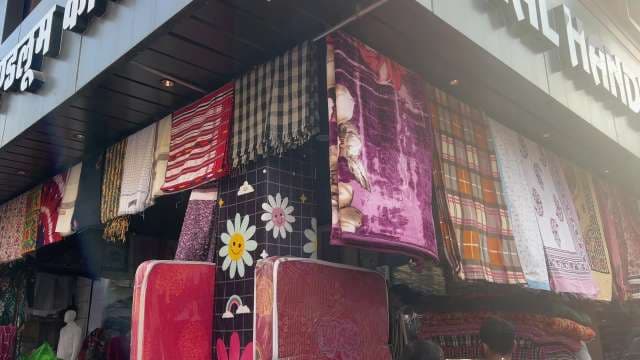 Colorful Blanket and Textile Market Display Outdoors