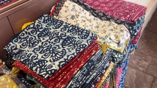Vibrant Handcrafted Indian Fabrics on Display at Market