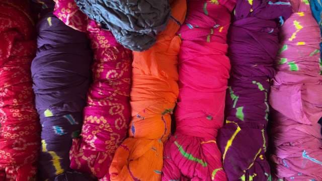 Vibrant Handcrafted Tie-Dye Fabrics Displayed in Rows