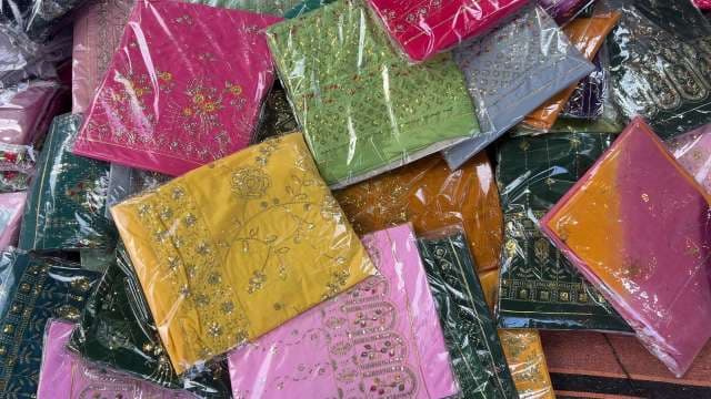 Colorful Embroidered Sarees on Display at Textile Market