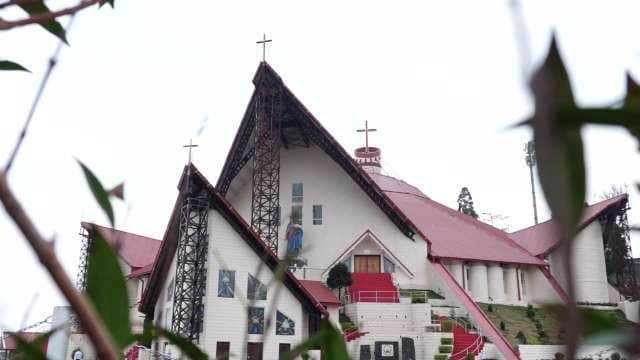 Majestic Modern Church with Striking Red Roof Architecture