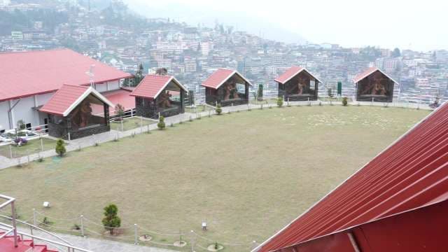 Hilltop Park With Sculptures Overlooking Gangtok Cityscape