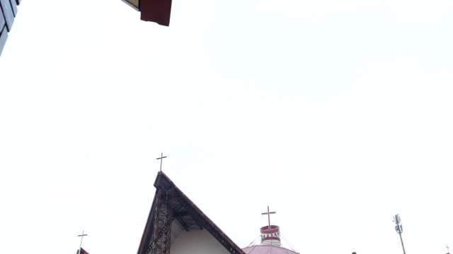 Modern Church Crosses Against Bright Sky
