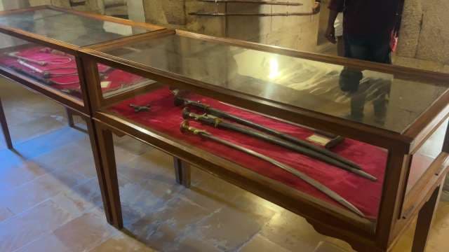 Historic Swords and Artifacts Displayed in Museum Exhibit at Jaisalmer Golden Fort, Rajasthan