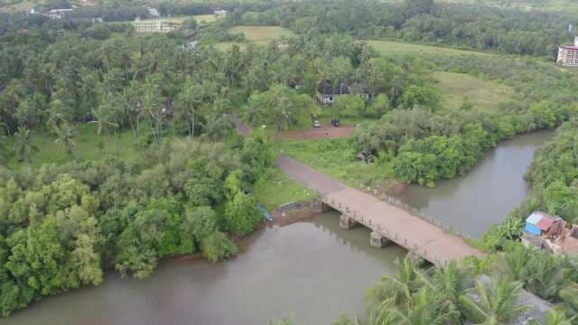 Aerial View of Rural Bridge Over Scenic River