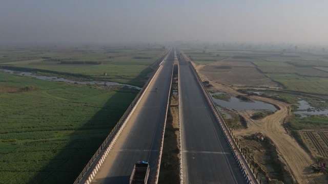 Aerial View of Empty Highway Through Rural Farmlands
