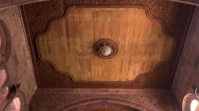 Intricate Wooden Ceiling With Ornate Carvings in Historic Building