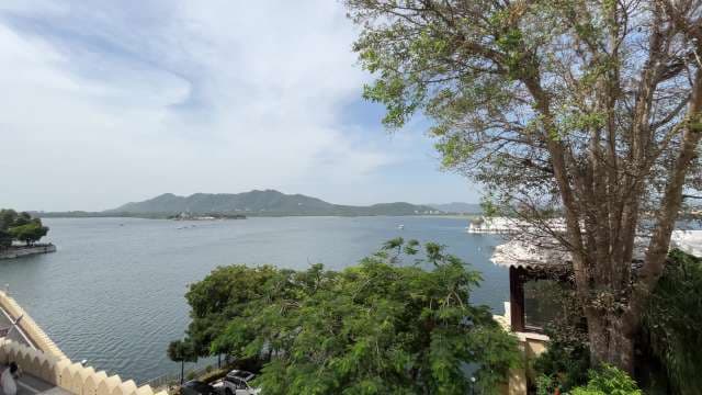 Scenic Lake View of Udaipur With Distant Island and Hills