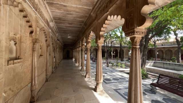 Exploring the Ornate Corridors of an Indian Palace Courtyard Udaipur