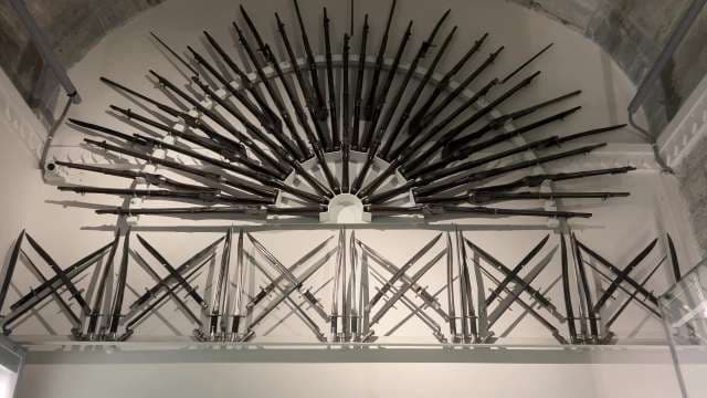 Historic Rifle and Bayonet Display at Museum Exhibit Udaipur