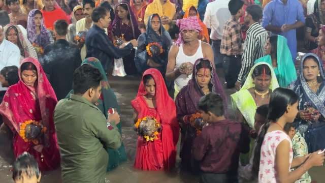 Devotees Celebrate Chhath Puja Ritual in Sacred River Gathering