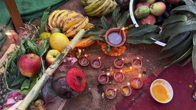 Traditional Hindu Ritual With Fruits, Diyas, and Offerings