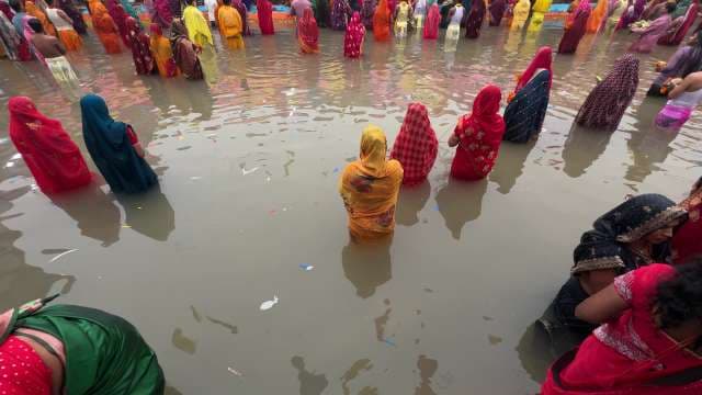 Hindu Women Celebrate Chhath Puja in Sacred River Ritual