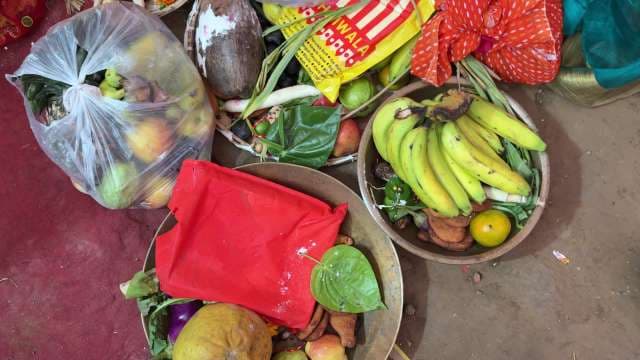 Traditional Indian Puja Offerings with Fruits and Sacred Items
