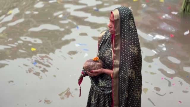 Indian Woman Performing Traditional River Ritual