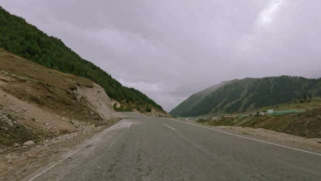 Serpentine Mountain Road Through Dramatic Valleys