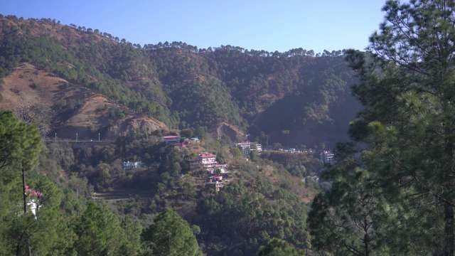 Himalayan Valley Village Nestled Among Forest-Covered Mountains