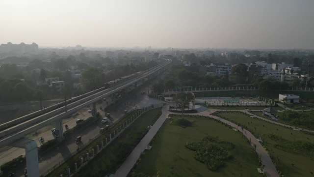 Elevated Highway Spanning Urban Cityscape and Green Space