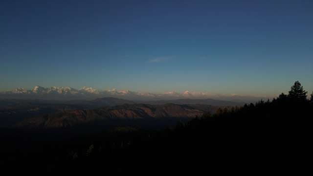 Golden Hour: Snow-Capped Himalayan Peaks at Sunset