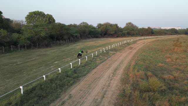 Horseback Trail Riding Through Rural Countryside Fields