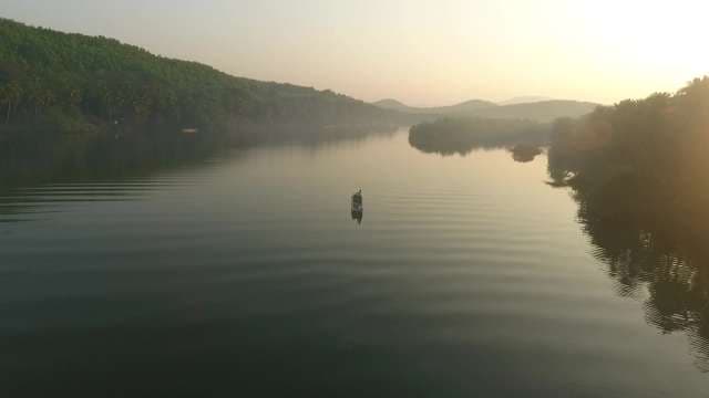 Aerial Saraswati River View at Golden Hour with Boat