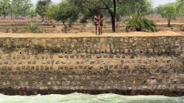 Children Bathing at Village Canal 
