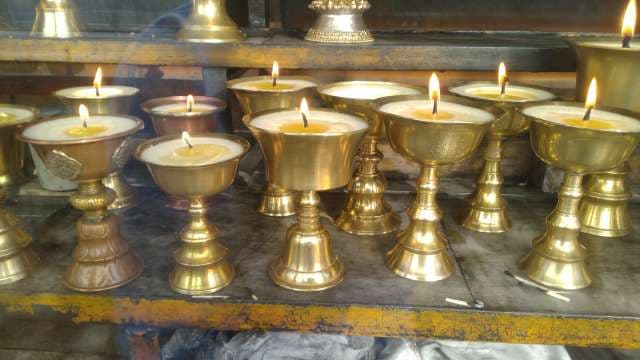 Sacred Brass Oil Lamps Burning in Hindu Temple