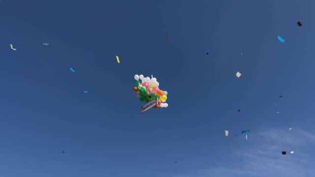 Colorful Kites Flying Against Blue Sky