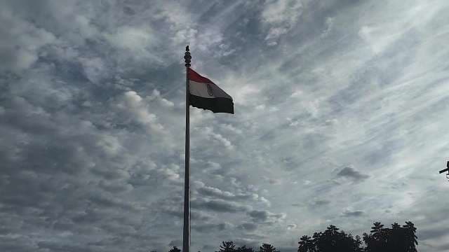 Indian Flag Waving Against Dramatic Cloudy Sky
