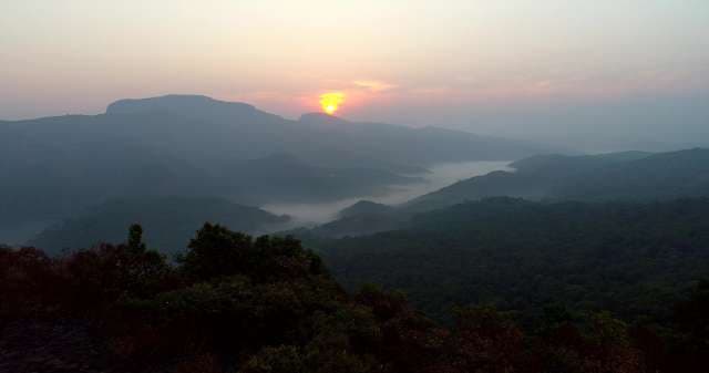 Misty Mountain Valley Sunrise Over Ancient Peaks
