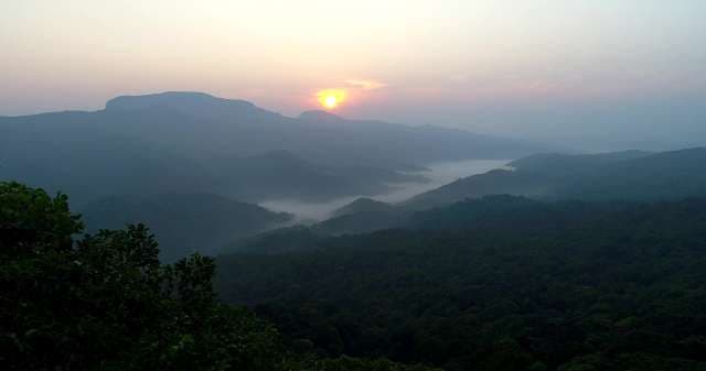 Misty Mountain Sunrise Over Tropical Valleys