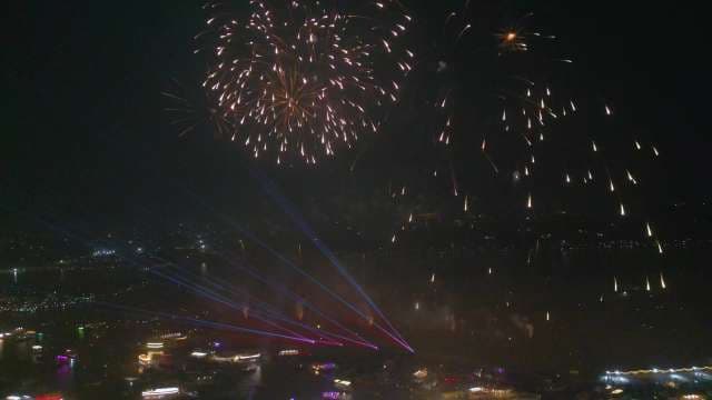 Spectacular Fireworks Display Over Night City Lights
