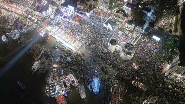Aerial Night View of Busy Harbor and Dense Urban Cityscape