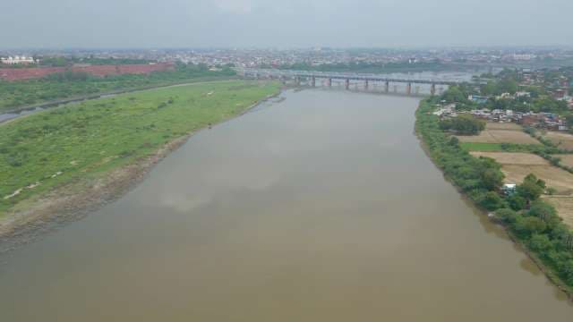 Aerial View of River Bridge and Agricultural Landscape
