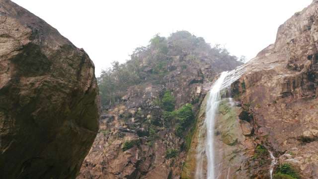 Rainbow Falls Cascading Through Rocky Canyon