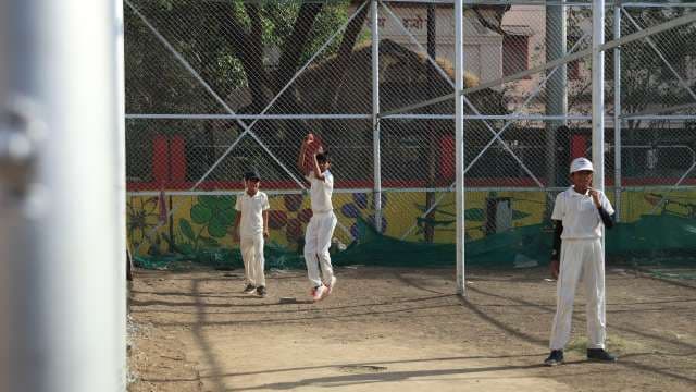 Kids Cricket Net Practice in Morning Light 