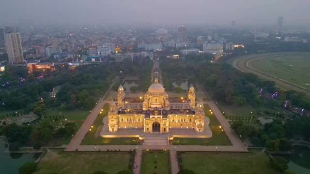 Majestic Victoria Memorial Illuminated Against the Kolkata City Skyline at Dusk