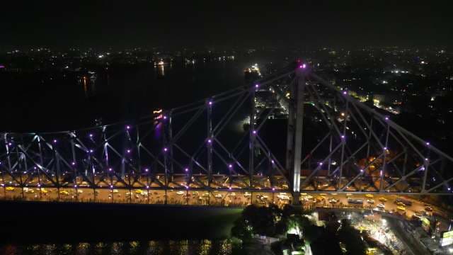 Stunning Night View of the Illuminated Howrah Bridge in Kolkata