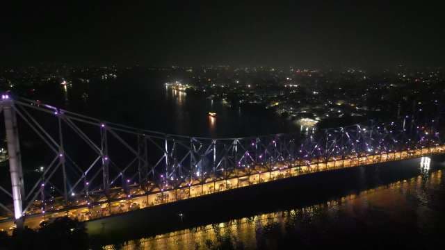 Stunning Night View of the Illuminated Howrah Bridge in Kolkata