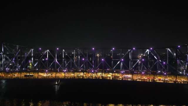 Stunning Night View of the Illuminated Howrah Bridge in Kolkata India
