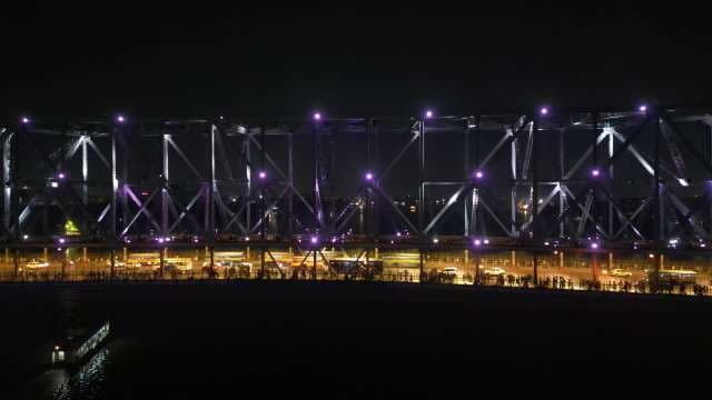 Bustling Night Life and Lights on the Iconic Howrah Bridge, Kolkata
