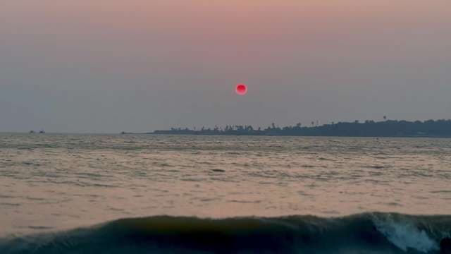 Dramatic Red Sun Setting Over Versova beach, Goa