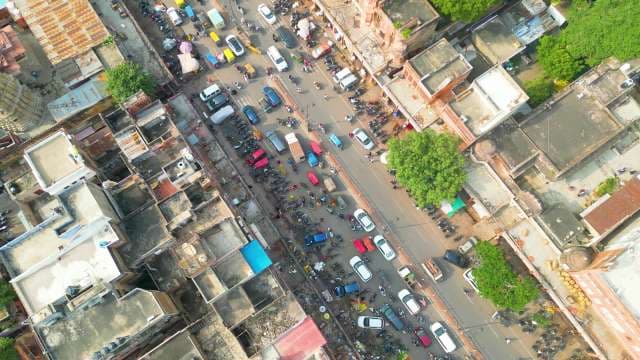 Aerial View of Crowded Street Traffic and Urban Life in India