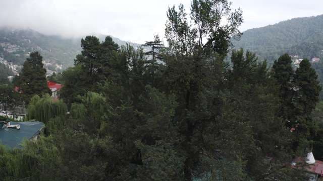 Breathtaking Aerial View of Lush Green Hill Station and Misty Mountains