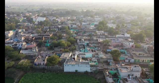 Aerial View of a Traditional Indian Village at Sunrise