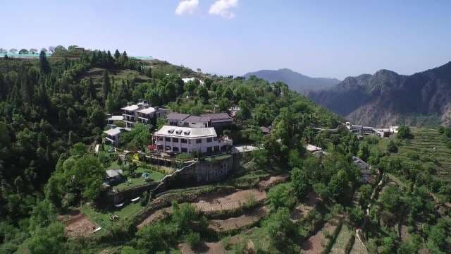 Aerial View of Luxury Resort Nestled in Lush Himalayan Mountains