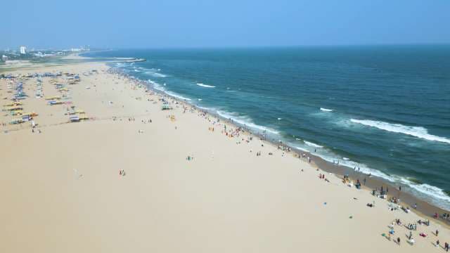 Aerial View of Crowded Marina Beach and Coastline in Chennai