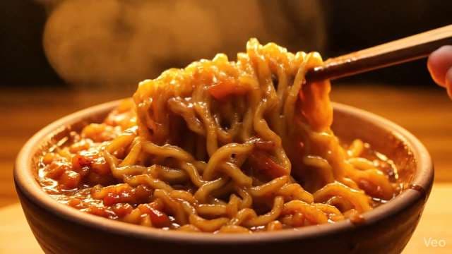 Steaming Hot Ramen Noodles with Chopsticks in Bowl